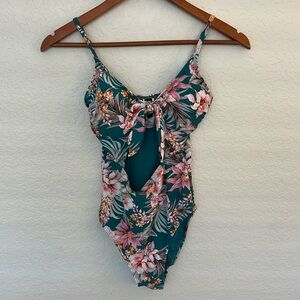 NipTuck swimsuit size 4- teal floral with cutout in front-New without tags